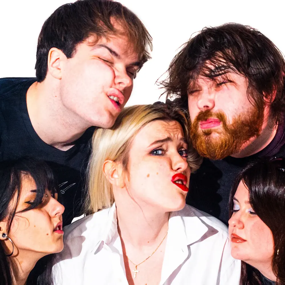 Five people with exaggerated facial expressions grouped closely against a white background. The mood is playful and dramatic.