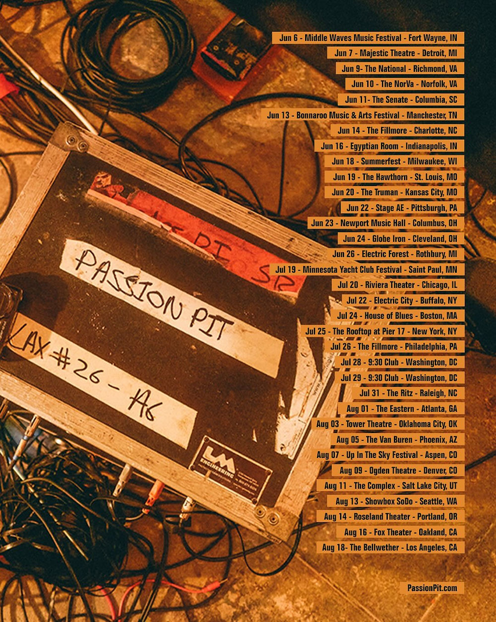 A music equipment case labeled "Passion Pit" with tangled cables. Tour dates are listed on the right. Background is a dim, wood-like floor.