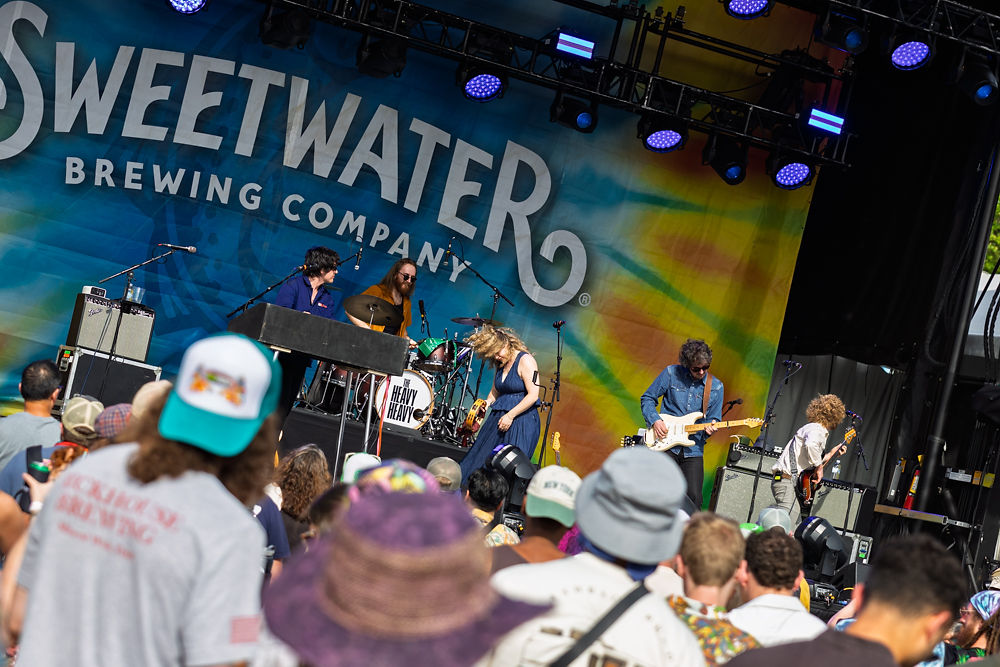 The Heavy Heavy performing live at SweetWater 420 Fest 2026 Atlanta crowd stage SweetWater Brewing backdrop