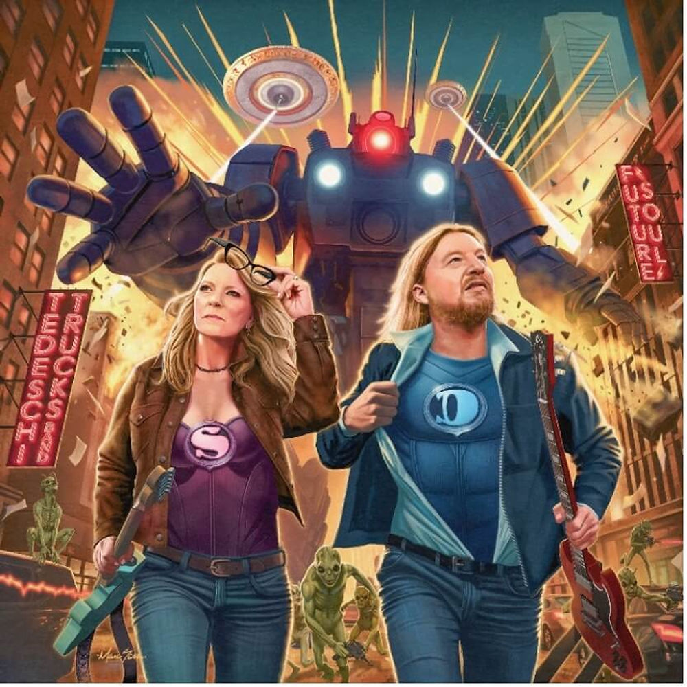 Two superheroes with guitars walk confidently in a city, facing a giant robot. Neon signs and green creatures are in the background. Energetic mood.